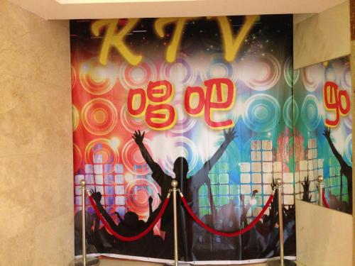 a mural of a person with their arms in the air at Dela Chambre Hotel in Manila