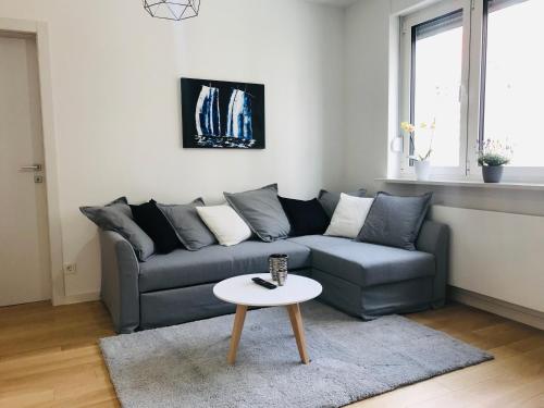 a living room with a couch and a table at Ocean Apartment in Zagreb