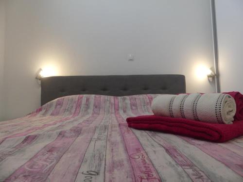 a bed with two pillows on top of it at Apartment Fran in Sonković