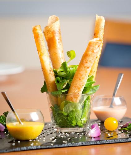 a bowl of food with bread and greens in it at Kyriad Prestige - Bordeaux Aeroport in Mérignac