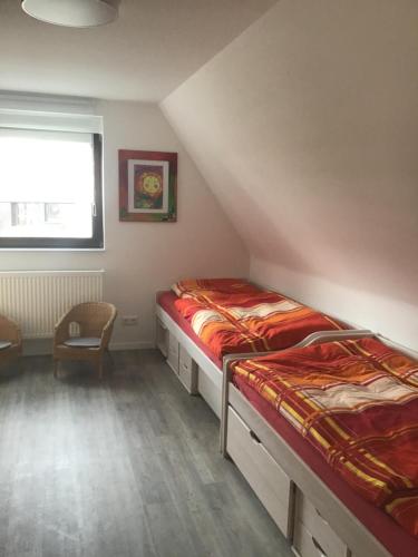 Ένα ή περισσότερα κρεβάτια σε δωμάτιο στο Ferienhaus Klasen