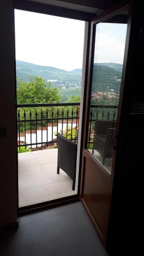 an open door to a balcony with a bench at Guest House Harmony in Veliko Tŭrnovo