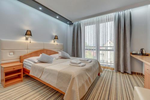 Cama o camas de una habitación en Aster
