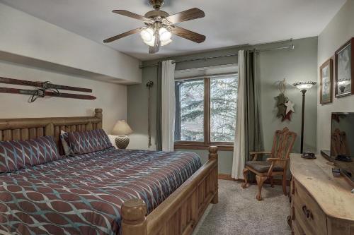 a bedroom with a bed and a ceiling fan at 2Br- Arrowhead Village- Great Location And Gorgeous Condo Condo in Beaver Creek