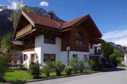 a house with a brown and white at Ferienwohnung Bitschnau Ulrike in Vandans