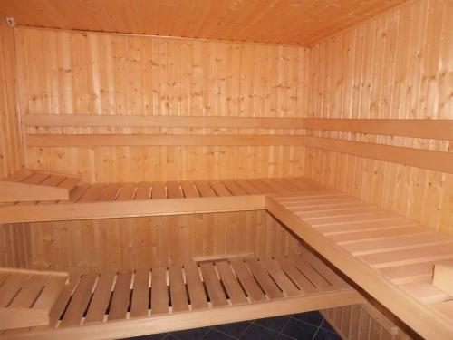 a wooden sauna with wooden shelves at Haus zur Kapelle in Sankt Gallenkirch