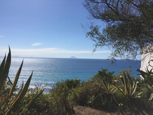 a view of the ocean from a hill at Residenza Gherly in Capo Vaticano