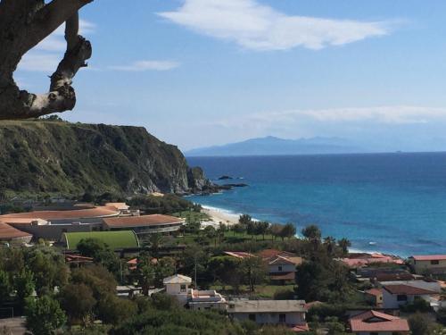 a view of a town and the ocean at Residenza Gherly in Capo Vaticano