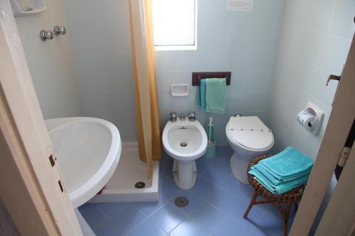 a bathroom with a sink and a toilet at Residenza Gherly in Capo Vaticano