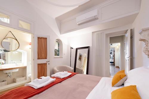 En eller flere senge i et værelse på Rome As You Feel - Cancelli Apartment