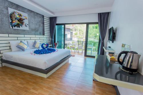 Postel nebo postele na pokoji v ubytování The Ozo Kohtao