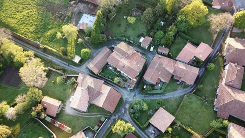 an overhead view of a group of houses in a suburb at La Maison Des Fleurs in Montembœuf