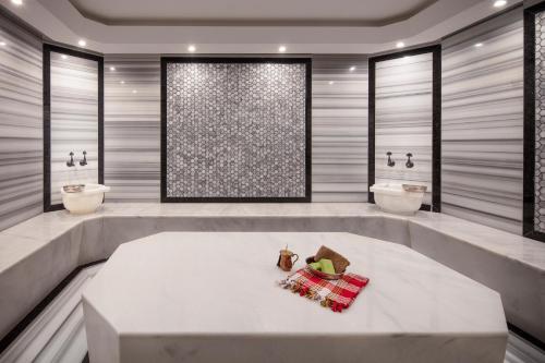 a bathroom with two sinks and two toilets at The Westist Hotel & Spa - Special Category in Istanbul