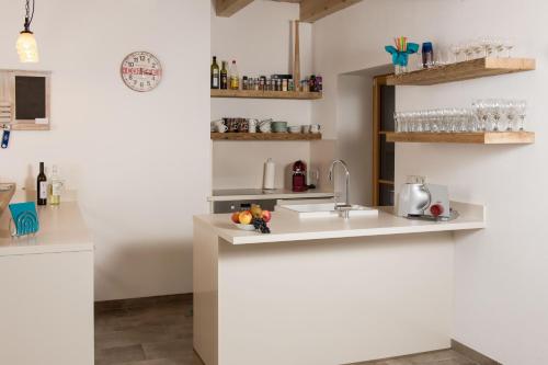 a kitchen with a sink and a counter top at Liebe zur Steiermark / Haus Tyrol in Jagerberg