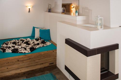 a room with a bed with a blanket on it at Liebe zur Steiermark / Haus Tyrol in Jagerberg