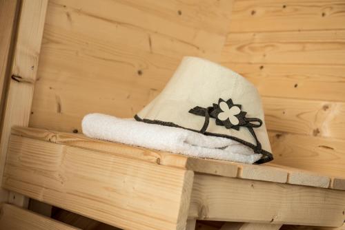 a towel in a sauna with a flower on it at Liebe zur Steiermark / Haus Tyrol in Jagerberg
