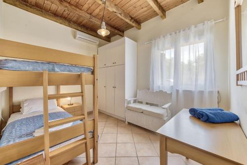 Katil atau katil-katil dalam bilik di Olivegrove Villa - Nestled in Olive Trees with Private Pool, by ZanteWize