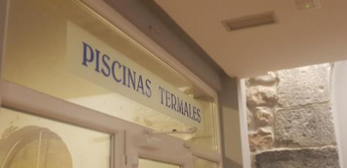 a sign for the entrance to a presbyterias hyannisemeteryemetery at Hotel Balneario De Alceda in Alceda