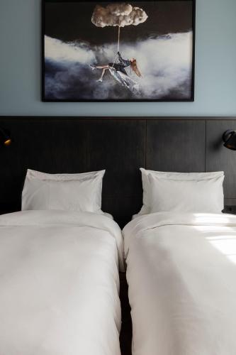 Postel nebo postele na pokoji v ubytování Radisson Blu 1919 Hotel, Reykjavík