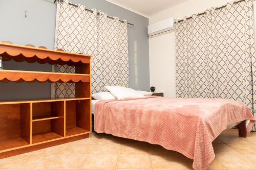En eller flere senge i et værelse på La Casita Torres