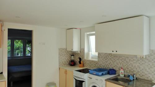 Kuchyňa alebo kuchynka v ubytovaní Apartman Paro