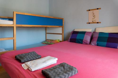 a bedroom with two bunk beds and two towels at Starfish Villa in Iraklitsa