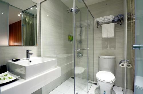 a bathroom with a sink and a toilet and a shower at ARK Hotel - Dongmen in Taipei