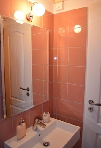 a bathroom with a sink and a mirror at Romanza Studios in Asos