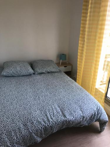 Postel nebo postele na pokoji v ubytování Résidence d’Artagnan