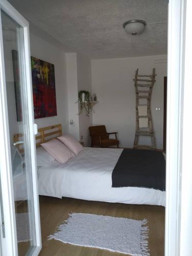 Guesthouse SOLEにあるベッド