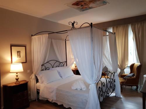 Tempat tidur dalam kamar di Locanda Elena