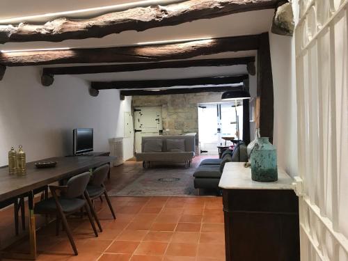 a living room with a couch and a table at Casa da Muralha Cerveira in Vila Nova de Cerveira