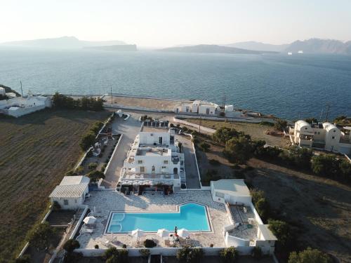 an aerial view of a villa with a swimming pool at The Fisherman's House Santorini in Akrotiri