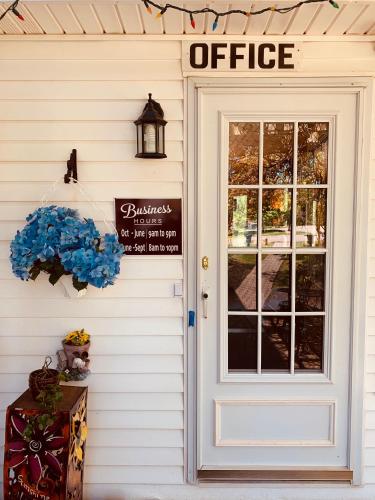 an office door on the side of a house at Fair Isle Motel in Charlottetown