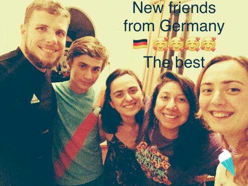 a group of people posing for a picture with the words new friends from german at Butichi Guest House in Chiatʼura
