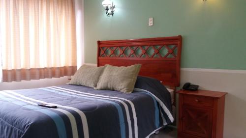 Een bed of bedden in een kamer bij Hotel Marsal