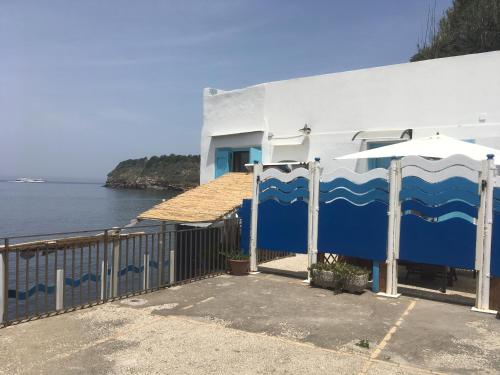a building with a blue and white painting on it at Azzurromare Residence in Procida