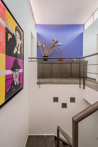 a room with a large painting on the wall at JUUB Colorful, Studio in New Polanco District (R1) in Mexico City