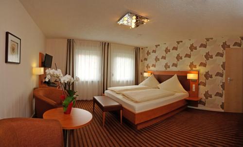 Postel nebo postele na pokoji v ubytování Hotel Nothwang