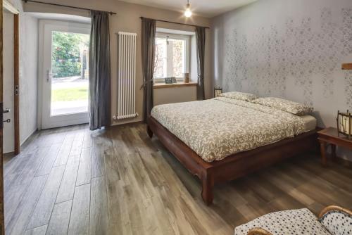 מיטה או מיטות בחדר ב-Happy hill - appartamento Bambù-natura e relax