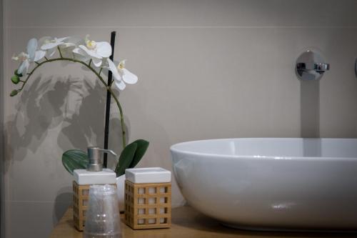a bathroom with a sink and a white bowl at AmaSi Affittacamere in Siracusa