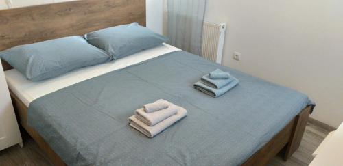Postel nebo postele na pokoji v ubytování Jovich Apartments 3