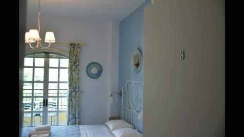 Katil atau katil-katil dalam bilik di Fofos Rooms