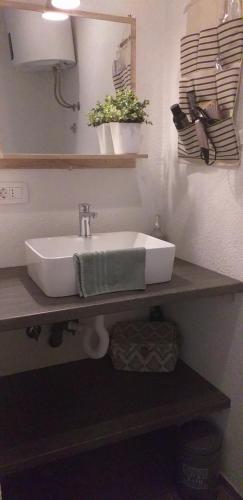 a white sink on a counter in a bathroom at Jovich Apartments 3 in Mošćenička Draga