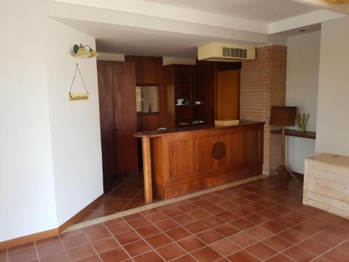 a room with a kitchen with a tiled floor at Oasi Club Village in Rocca dʼEvandro
