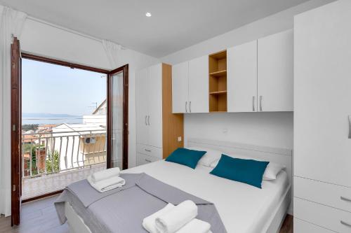 Postel nebo postele na pokoji v ubytování Blue Dream Apartment