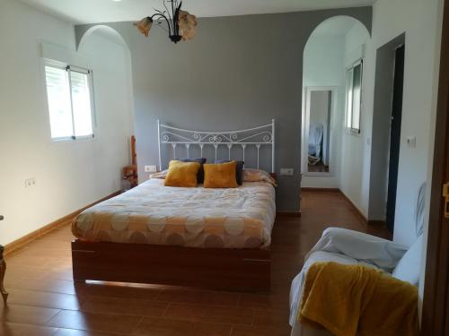 a bedroom with a bed with two pillows on it at Casa Rural en Escullar - La Real in Escúllar