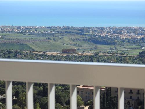 a view of a city from the balcony of a building at Hedoné Design Experience B&B in Agrigento