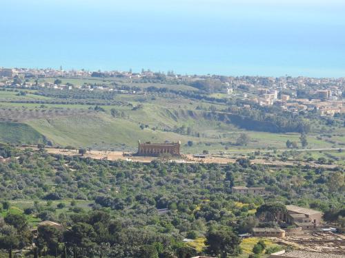a view of a city from the top of a hill at Hedoné Design Experience B&B in Agrigento