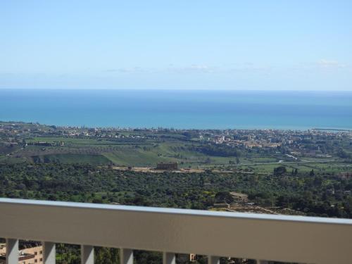 a view of a city from the balcony of a building at Hedoné Design Experience B&B in Agrigento